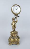 Horlogerie: Pendule en métal doré -putto tenant une fleur- made in Italy H:40cm