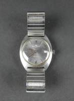 Bijou : Montre bracelet d'homme en acier BAUME & MERCIER Baumatic avec dateur mvt automatique (en état) (couronne remplacée , points d'oxydation) bracelet rapporté