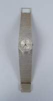 Bijou : Montre bracelet de dame BUECHE-GIROD (ds l'état) en or blanc 18K mouvement à remontoir cadran entouré de diamants