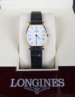 Bijou : Montre bracelet d'homme LONGINES la grande classique forme tonneau en plaqué or mvt à quartz (En état)